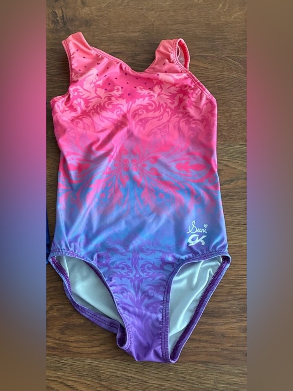 GK elite gymnastics leotards and Suni Lee